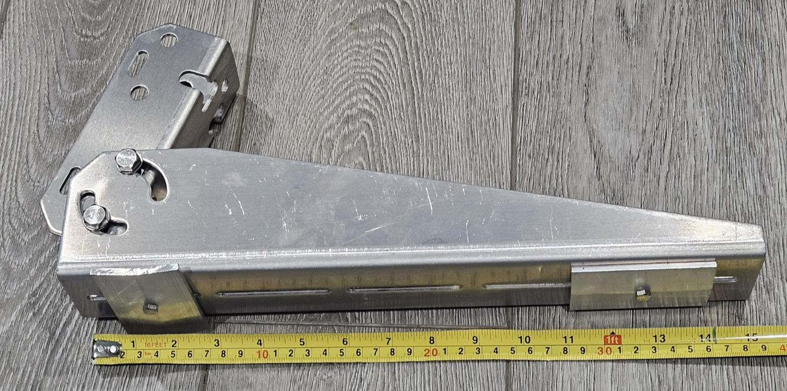 Adjustable angle bracket for pole mounting a small solar panel